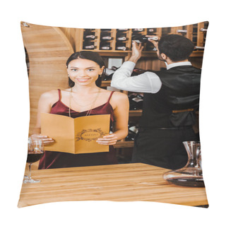 Personality  Smiling Woman Holding Menu Card At Wine Store While Steward Taking Bottle From Shelf On Background Pillow Covers
