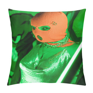 Personality  Sexy Woman In Knitted Balaclava And Shiny Top Posing Near Neon Lamp And Wall With Graffiti In Green Lighting Pillow Covers