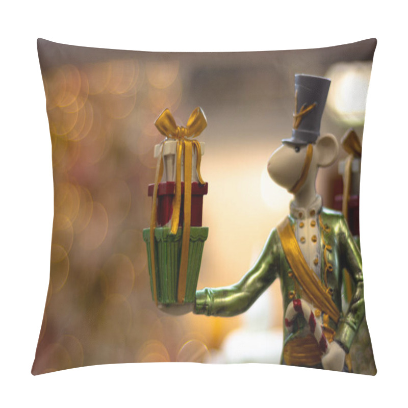 Personality  A figurine of a mouse holding gifts in his hand. Mouse from the fairy tale about the nutcracker. Shallow depth of field. pillow covers
