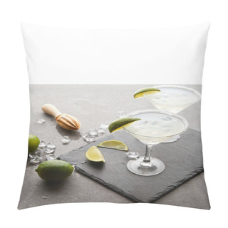 Personality  Close Up View Of Margarita Cocktails With Lime Pieces And Wooden Squeezer On Grey Surface  On White Pillow Covers