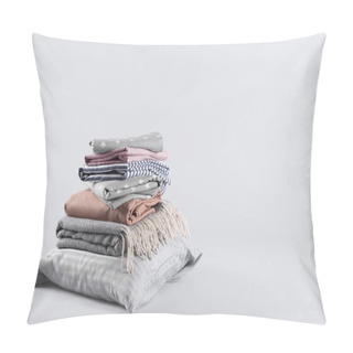 Personality  Stack Of Clean Bed Sheets And Pillow On White Background. Space For Text Pillow Covers