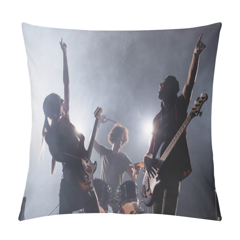 Personality  KYIV, UKRAINE - AUGUST 25, 2020: Rock Band Guitarists With Hands In Air Singing With Smoke And Drummer On Background Pillow Covers