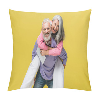 Personality  Cheerful Middle Aged Man Piggybacking Happy Asian Wife With Digital Tablet Isolated On Yellow  Pillow Covers