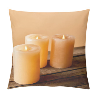 Personality  Three Burning Candles On Wooden Table On Beige  Pillow Covers