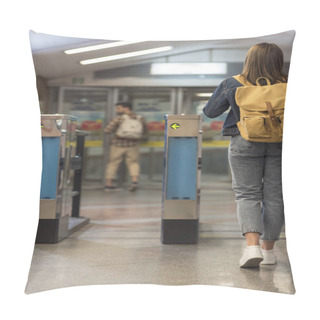 Personality  Rear View Of Female Stylish Traveler With Backpack Passing Through Turnstiles And Male Tourist Behind Pillow Covers