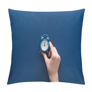 Personality  Cropped View Of Woman Holding Small Alarm Clock On Blue Background Pillow Covers