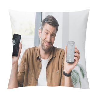 Personality  Confused Businessman With Shrug Gesture Looking At Camera While Holding Smashed Smartphones On Blurred Background Pillow Covers