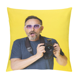 Personality  Passionate Old Photographer Beams With Excitement, Holding Mirrorless Photo Camera, In Isolated Studio Shot On Yellow Background. Seasoned Photographer Continues Pursue Photography Passion With Zeal Pillow Covers
