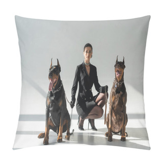 Personality  Elegant Woman Looking At Camera Near Dobermans On Chain Leashes On Grey Background With Shadows Pillow Covers