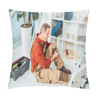 Personality  Repairman Sitting On Floor And Holding Injured Knee Surrounding By Equipment In Office Pillow Covers