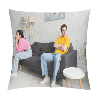 Personality  Disappointed Young Man With Crossed Arms Sitting On Couch Near Girlfriend With Hands Near Face In Living Room Pillow Covers