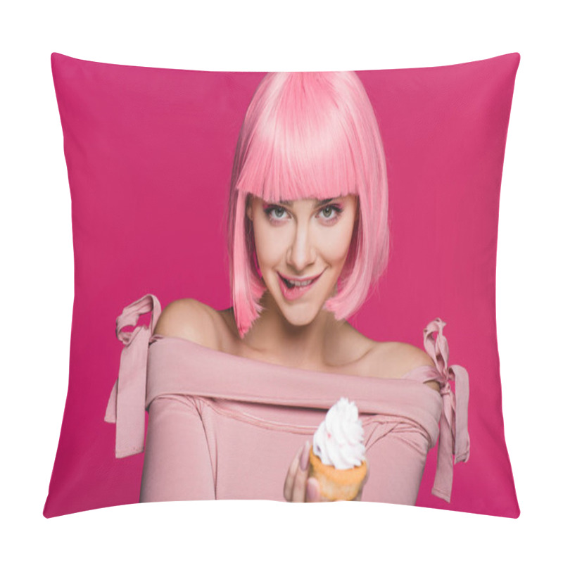 Personality  happy sensual girl biting lip and holding sweet cupcake isolated on pink pillow covers