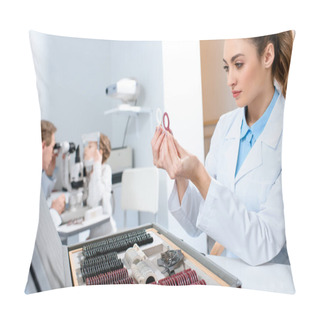 Personality  Female Optometrist Holding Lenses For Trial Frame While Colleague Examining Kid With Visual Field Test Pillow Covers