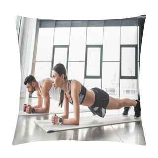 Personality  Side View Of Athletic Young Couple In Sportswear Doing Plank Exercise On Yoga Mats In Gym  Pillow Covers