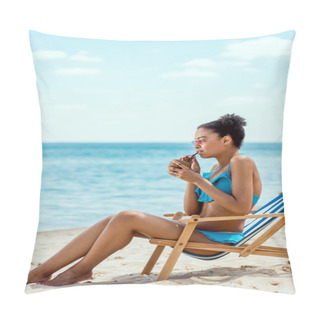 Personality  Young African American Woman In Bikini And Sunglasses Drinking Cocktail In Coconut Shell While Sitting On Deck Chair In Front Of Sea  Pillow Covers