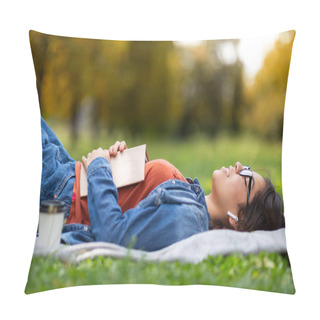 Personality  Outdoor Leisure. Nerdy Young Arab Female In Eyeglasses Lying On Lawn With Book, Millennial Middle Eastern Female Resting With Closed Eyes In Park And Listening Music In Earphones, Side View Pillow Covers