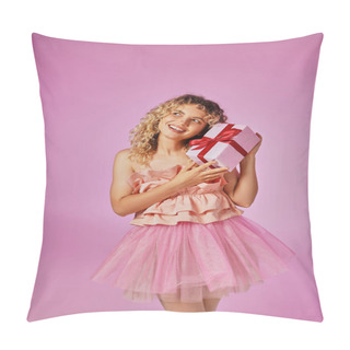 Personality  Cheerful Curly Haired Woman In Pink Attire Looking Happily At Camera And Holding Present Near Face Pillow Covers