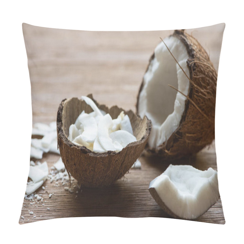 Personality  selective focus of fresh tasty coconut half near flakes in shell on wooden table pillow covers