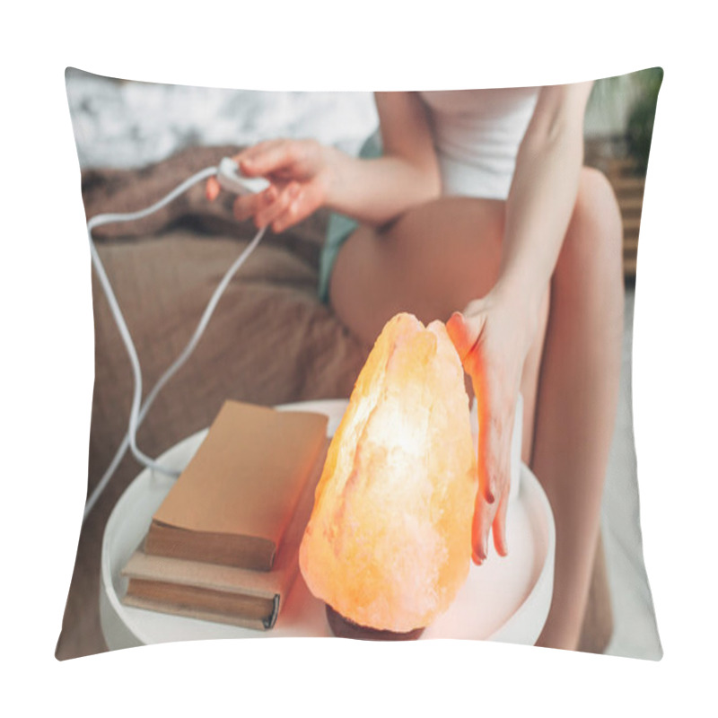 Personality  Cropped View Of Young Woman Switching Himalayan Salt Lamp In Bedroom With Books Pillow Covers