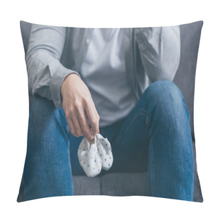 Personality  Cropped View Of Man Sitting On Grey Couch And Holding Babe Socks At Home, Grieving Disorder Concept Pillow Covers