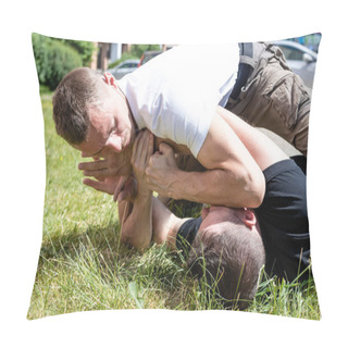 Personality Martial Arts Instructors Krav Maga Demonstrate Self-defense Techniques In A Street Fight. A Man Fixes The Opponents Hands In A Fight While Lying Down. Pillow Covers