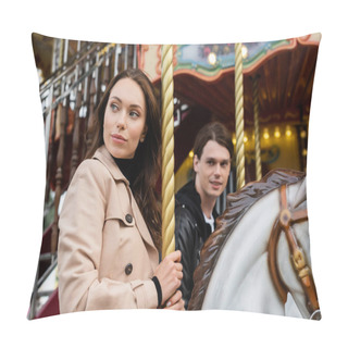 Personality  Pretty Woman In Trench Coat Riding Carousel Horse Near Blurred Boyfriend In Amusement Park Pillow Covers