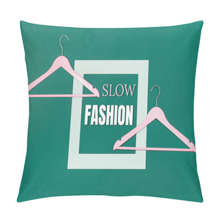 Personality  Slow Fashion Text And Two Empty Coat Hangers On Green Background. Sustainable Approach To Manufacturing And Eco-friendly Anti-consumerism Concept. Conscious Buying Awareness. Copy Space Pillow Covers