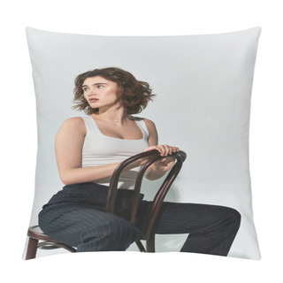 Personality  A Pretty Young Woman Poses Gracefully On A Wooden Chair, Exuding Elegance And Confidence In A Studio Setting. Pillow Covers