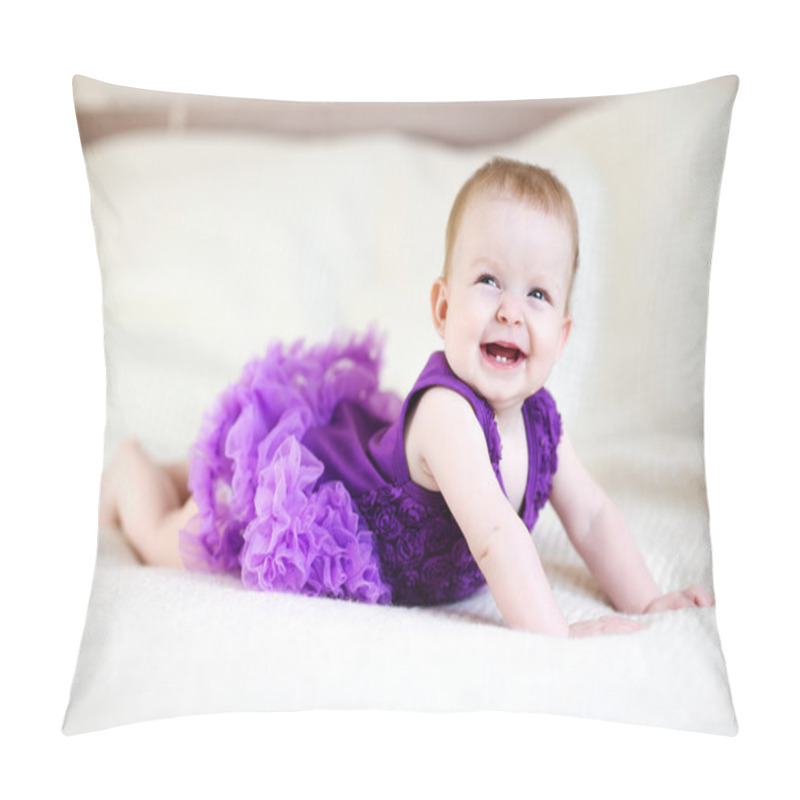 Personality  Laughing baby girl in purple dress on white bed pillow covers