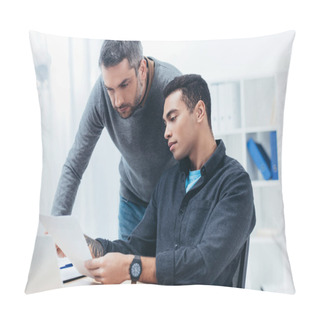 Personality  Bearded Mentor Looking At Young Colleague Working With Papers In Office Pillow Covers