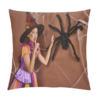 Personality  Spooky Girl In Witch Hat And Halloween Costume Showing Hush Near Fake Spider On Brown Background Pillow Covers