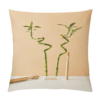 Personality  Bamboo Toothbrush With Ear Sticks On White Table And Green Bamboo On Beige Background Pillow Covers