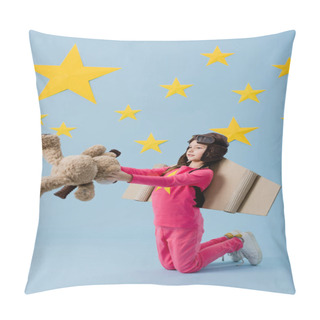 Personality Kid With Cardboard Wings Standing On Knees And Holding Teddy Bear On Blue Starry Background Pillow Covers