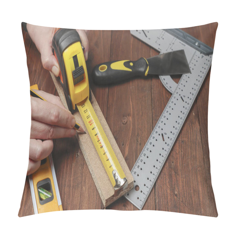 Personality  Horizontal View From Above Of Two Hands Using A Pencil And A Flexometer To Measure The Lenght Of A Wood Strip On A Set With Others DIY Tools Pillow Covers
