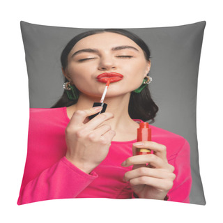 Personality  Alluring Young Woman With Shiny Brunette Hair And Closed Eyes Pouting Lips While Applying Red Lip Gloss On Lips Isolated On Grey Background  Pillow Covers