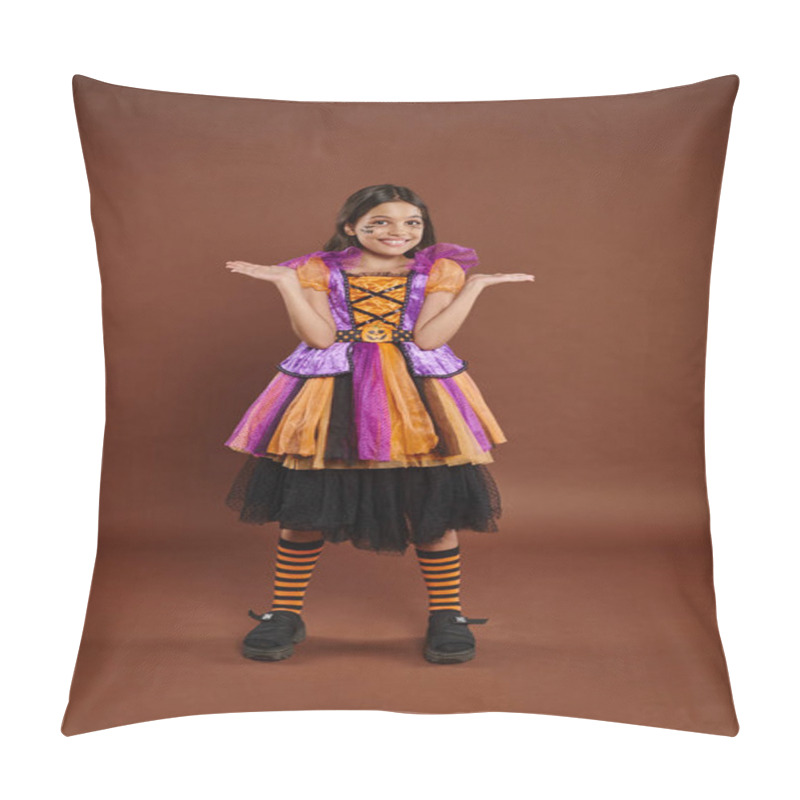 Personality  funny girl in Halloween costume with spiderweb makeup smiling and gesturing on brown backdrop pillow covers