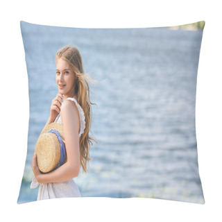 Personality  Beautiful Young Girl Standing On Shore Of River While Holding Straw Hat And Looking At Camera Pillow Covers
