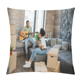 Personality  Cheerful African American Couple With Coffee Playing Acoustic Guitar Near Boxes In New House Pillow Covers