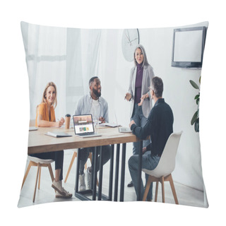 Personality  KYIV, UKRAINE - DECEMBER 6, 2019: Smiling Multicultural Colleagues Talking With Asian Businesswoman Near Laptop With Shutterstock Website  Pillow Covers