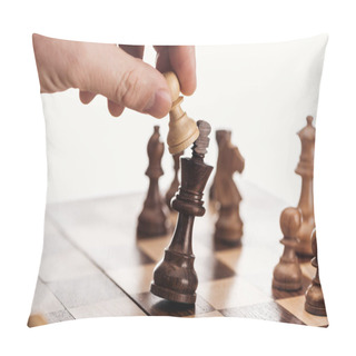 Personality  Partial View Of Man Holding Pawn Above Wooden Chessboard Isolated On White Pillow Covers