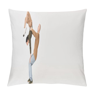 Personality  Couple In Casual Attire Performing An Intricate Acrobatic Balance In Studio On Grey Backdrop, Banner Pillow Covers