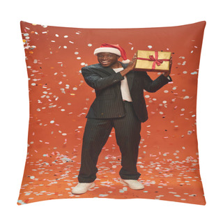 Personality  Cheerful African American Man In Elegant Suit And Santa Hat Holding Present Under Confetti On Red Pillow Covers