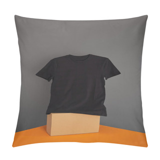 Personality  Basic Black T-shirt On Cube On Grey And Orange Background Pillow Covers