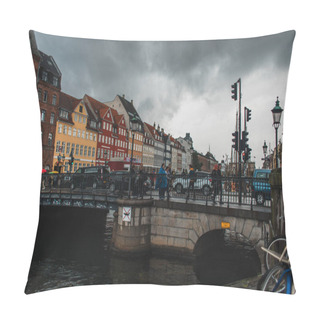 Personality  COPENHAGEN, DENMARK - APRIL 30, 2020: People Walking On Bridge Near Canal With Nyhavn Urban Street And Cloudy Sky At Background   Pillow Covers