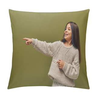 Personality  Cheerful And Trendy Preteen Girl With Dyed Stands Of Hair Wearing Modern Knitted Sweater And Pointing With Finger Isolated On Green, Contemporary Fashion For Preteen Concept Pillow Covers