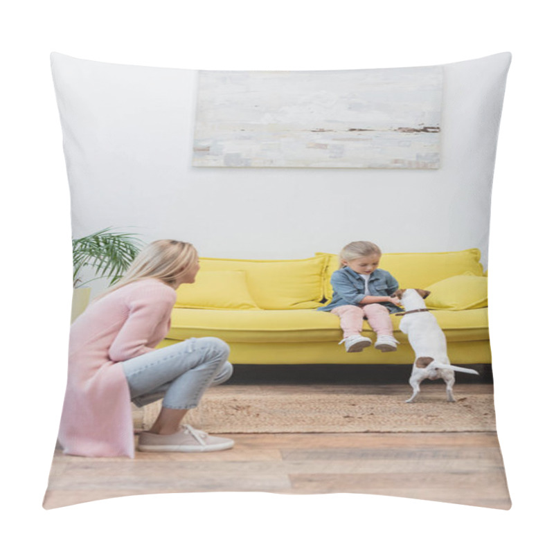 Personality  Child playing with jack russell terrier on couch near mom at home pillow covers