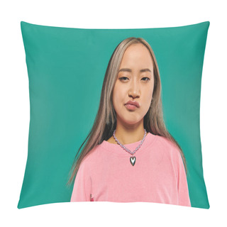 Personality  Portrait Of Skeptical And Young Asian Girl In Pink Sweatshirt Posing On Turquoise Background Pillow Covers