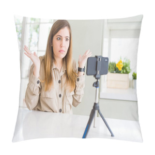 Personality  Beautiful Young Woman Doing Online Video Call Using Smartphone Webcam Clueless And Confused Expression With Arms And Hands Raised. Doubt Concept. Pillow Covers