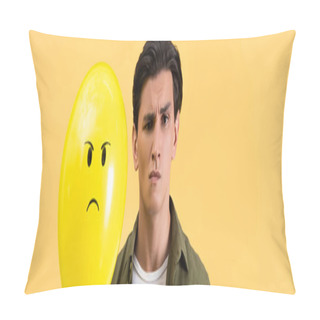 Personality  Panoramic Shot Of Skeptical Man Holding Angry Balloon, Isolated On Yellow Pillow Covers