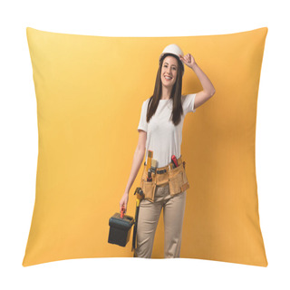 Personality  Smiling Handywoman In Helmet Holding Toolbox On Yellow Background  Pillow Covers